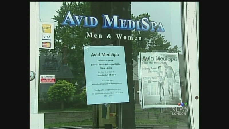 A note on the door of Avid MediSpa indicates the reason for the temporary closure in London, Ont. on Tuesday, July 8, 2014. (Sean Irvine / CTV London)