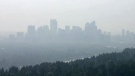 Calgary's skyline is shrouded with haze on July 11, 2014, a result of smoke drifting down from several wildfire burning in the northern regions of Alberta and B.C.