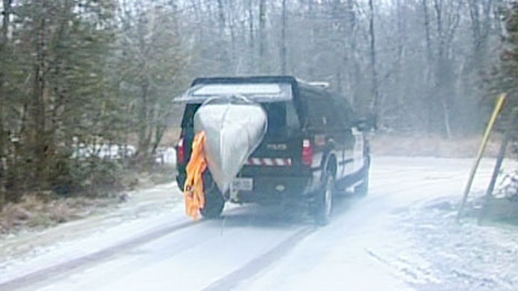The canoe involved in a tragic incident on Lake Couchiching on Tuesday, Dec. 27, 2011 is removed.