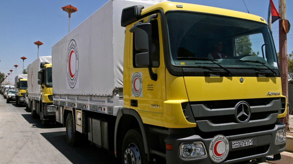 Red Crescent trucks deliver aid to Syria