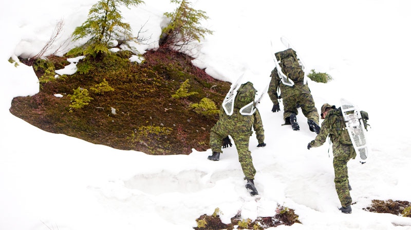Members of the Canadian military are seen taking part in a exercise on Cypress Mountain in West Vancouver, B.C. on Jan. 28, 2010. (Jonathan Hayward / THE CANADIAN PRESS)
