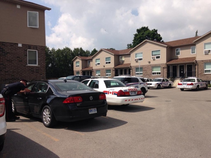Police cruisers sit in the area on Southdale Road East where a man was found seriously injured in London, Ont. on Tuesday, July 15, 2014. (Cristina Howorun / CTV London)