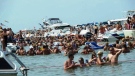 Party goers fill Lake St. Clair near Muscamoot Bay, Mich., in this undated photo. (Tour Lake St. Clair/ Facebook)