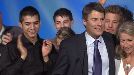 Vancouver Mayor Gregor Robertson celebrates his re-election with foster son Jinagh Navas-Rivas, far left. Nov. 19, 2011. (CTV)