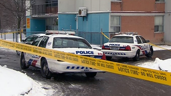 Police investigate the scene of a deadly shooting in Scarborough, Friday, Dec. 30, 2011.