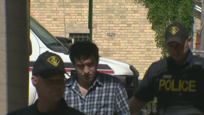 Xhevahir Myftari is escorted into the Guelph courthouse on Thursday, July 17, 2014.