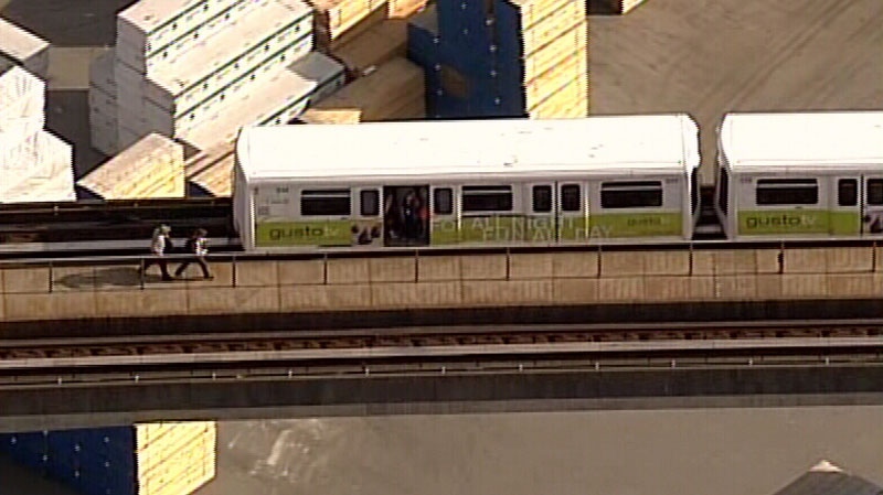 Riders forced SkyTrain doors open and jumped out during a delay Thursday afternoon. July 17, 2014.