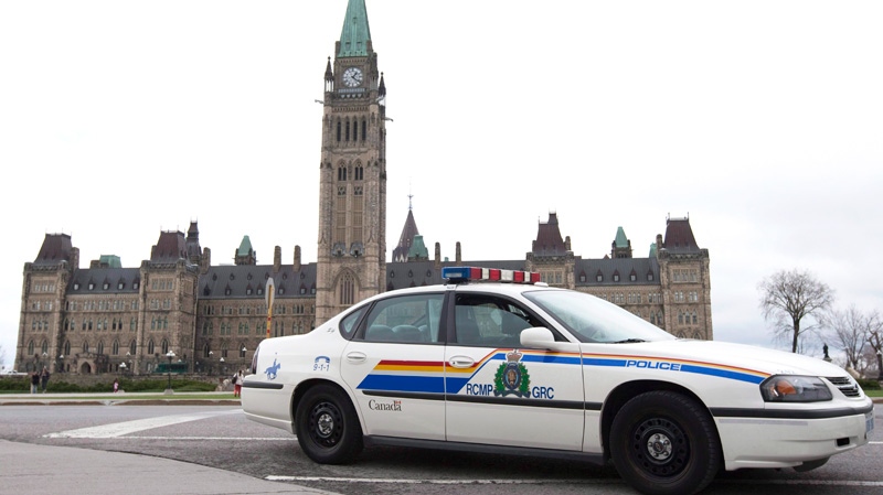 An RCMP vehicle sits guarding Parliament Hill in Ottawa, Wednesday, April 7, 2010. (Adrian Wyld / THE CANADIAN PRESS)