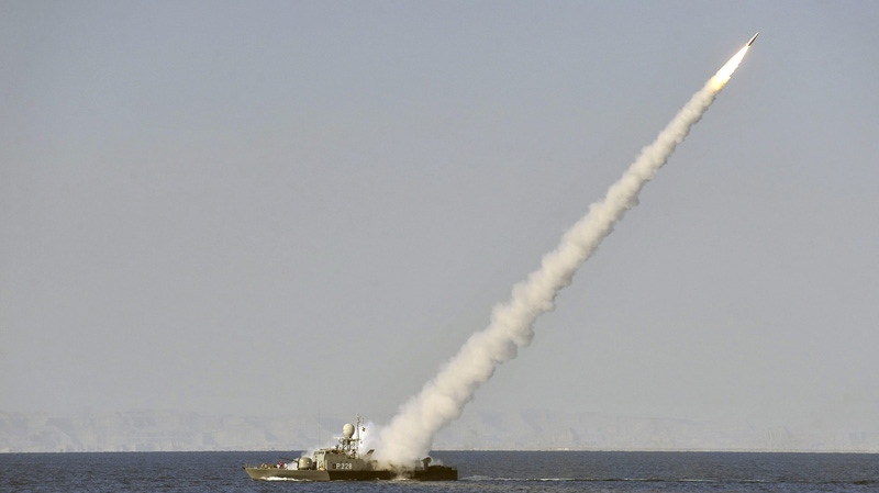 In this image made available by the Iranian Students News Agency, an Iranian navy vessel launches a missile during a drill at the sea of Oman, on Sunday, Jan. 1, 2012. (AP Photo/ISNA,Amir Kholousi)