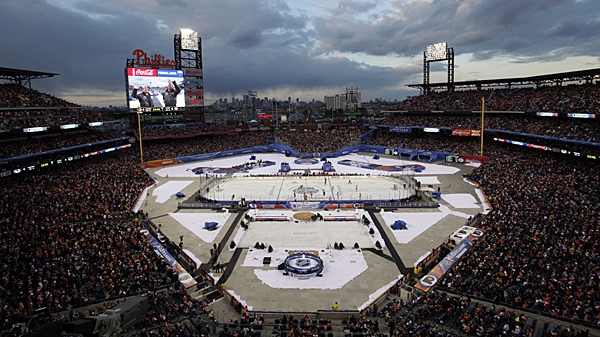 Fans watch the second period of the NHL Winter Classic hockey game between the Philadelphia Flyers and the New York Rangers on Monday, Jan. 2, 2012, in Philadelphia. (AP Photo/Mel Evans)