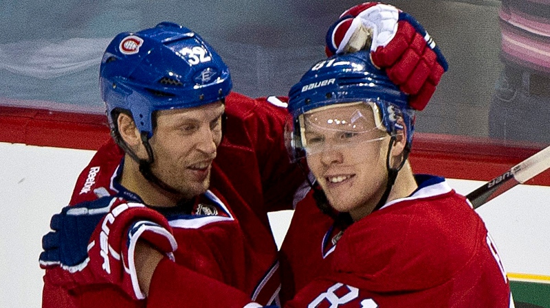 Montreal Canadiens' Lars Eller, right, is congratulated by teammate Travis Moen after a goal against the Winnipeg Jets during first period NHL hockey action Wednesday, January 4, 2012 in Montreal. THE CANADIAN PRESS/Paul Chiasson