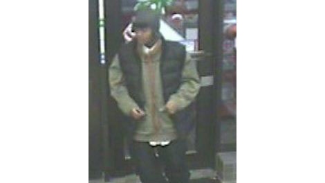 Police are looking for this man and another suspect after a carjacking and two home robberies on Christmas Eve. 