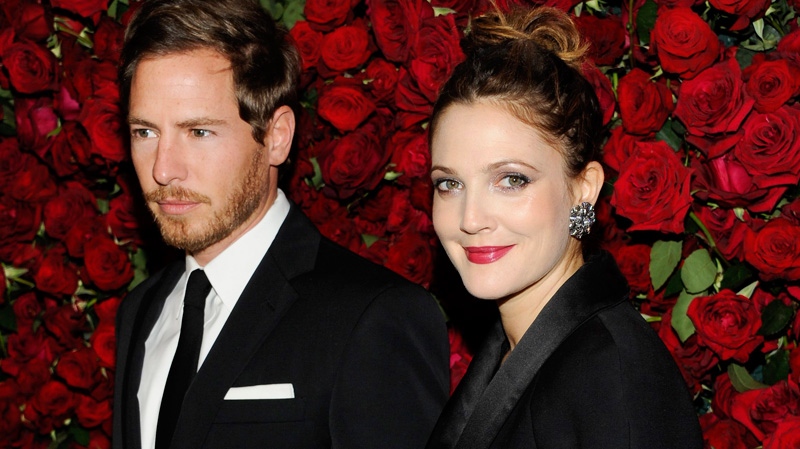 Actress Drew Barrymore, right, and boyfriend Will Kopelman attend The Museum of Modern Art Film Benefit tribute to Pedro Almodovar on Tuesday, Nov. 15, 2011 in New York. (AP / Evan Agostini)
