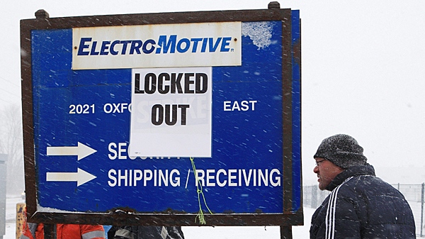 Locked-out workers and supporters picket at the locomotive-maker Electro-Motive facility in London, Ontario, Monday, Janurary 2, 2012. (THE CANADIAN PRESS/Dave Chidley)