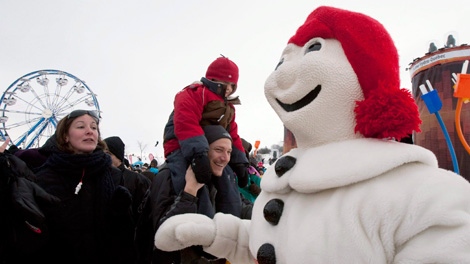 Bonhomme Carnaval is cheeres while attending an event as part of Quebec' winter carnival in Quebec City, Saturday, Feb. 5, 2011. (Jacques Boissinot / THE CANADIAN PRESS)