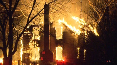 A southern Ontario farmhouse where a bizarre basement dungeon was recently discovered went up in flames overnight, Durham Regional Police said on Friday, Jan. 6, 2012.