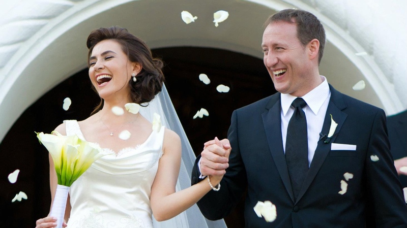 Newly-wed Defence Minister Peter MacKay exits a Mexico wedding chapel with Nazanin Afshin-Jam on Jan. 4, 2012. 