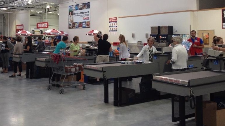 Shoppers go through the checkouts at the Costco store in Guelph, Ont., on Friday, July 25, 2014. (Krista Simpson / CTV Kitchener)