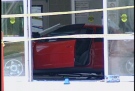 A car sits inside the main entrance to the Costco location after crashing through the doors in south London, Ont. on Friday, July 25, 2014. (Chuck Dickson / CTV London)