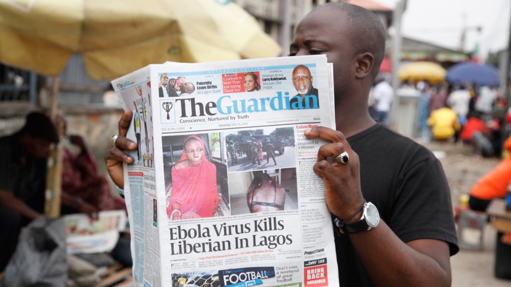 A man reads a newspaper in Lagos, Nigeria