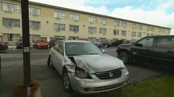 Woman hits pedestrian, 3 parked cars