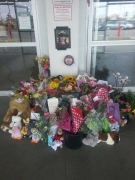 A memorial honouring Addison Hall is growing at the Costco in south London, Ont. on Monday, July 28, 2014. 