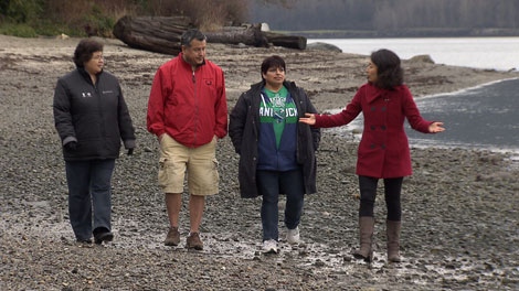 CTV investigative reporter Mi-Jung Lee walks the shore of the Tsleil-Waututh reserve with a trio of elders. Jan. 10, 2012. (CTV)