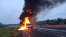 A Tractor-trailer on fire closes Highway 401 east of Belleville on Wednesday, July 30, 2014. (Brian Jones/Twitter: @Highway_Life)