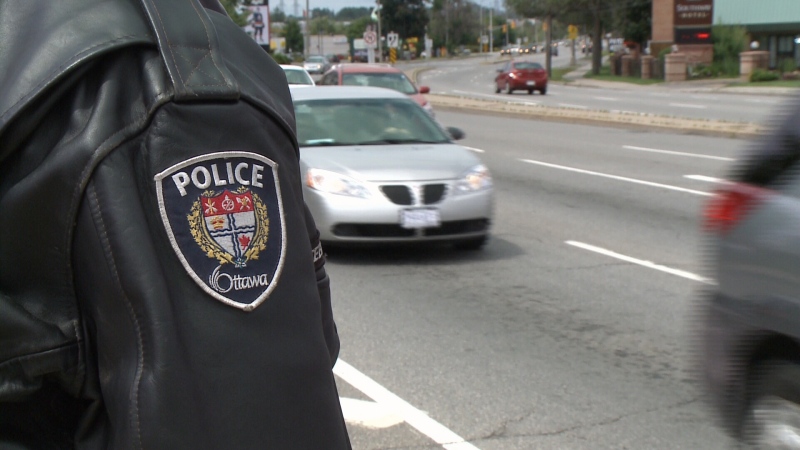 Ottawa Police patrol the intersection of Hunt Club Road and Bank Street, July 30th, 2014