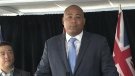 Michael Coteau speaks with reporters in this file photo.