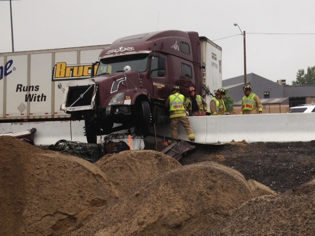 A transport truck slammed into a barrier, blocking all lanes, while traveling eastbound on Highway 417 near the Nicholas exit just before 5:30 a.m. on Thursday, July 31, 2014.(Jim O'Grady/CTV Ottawa)