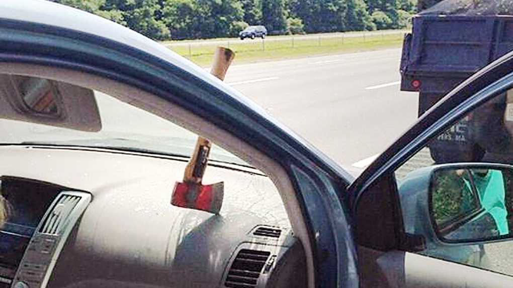 Axe head rests on the dashboard