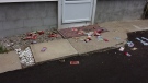 Cash is seen strewn across the ground near the location of a robbery at the Scotiabank on Hamilton Road in London, Ont. on Thursday, July 31, 2014. (Mark Turner / MyNews)
