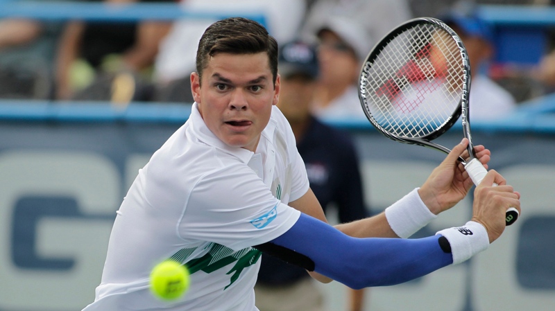 Milos Raonic, of Canada, returns the ball to Lleyt