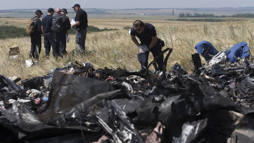 Investigators at the site of the MH17 crash