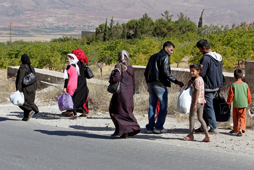 Syrian family flees town of Arsal