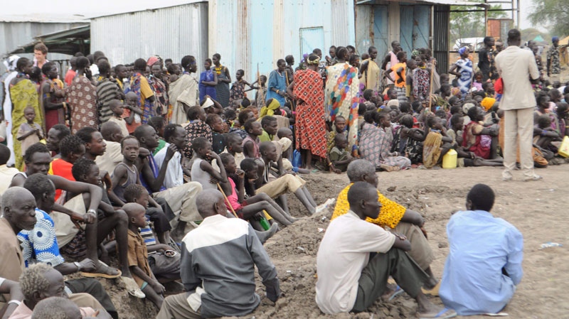 Victims of ethnic violence in Jonglei state in South Sudan wait in line at the World Food Program distribution center in Pibor to receive emergency food rations on Thursday, Jan .12, 2012. (AP / Michael Onyiego)