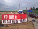 A protest banner hangs outside a work site for Enbridge's Line 9 pipeline near Innerkip, Ont., on Tuesday, Aug. 5, 2014. (Marc Venema / CTV Kitchener)