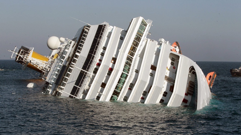 A luxury cruise ship Costa Concordia leans on its side after running aground the tiny Tuscan island of Giglio, Italy, Saturday, Jan. 14, 2012. (AP Photo/Gregorio Borgia)