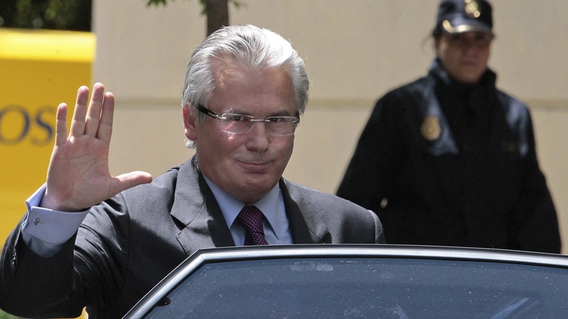 In this May 14, 2010 file photo, Spanish Judge Baltasar Garzon gestures as he leaves the National Court before getting into a car. (AP Photo /Arturo Rodriguez, File)