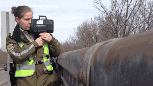 A Surete du Quebec officer using a laser speed detector. (Kevin Gallagher / CTV Montreal)