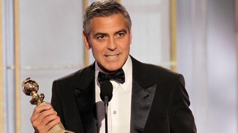 George Clooney accepts the award for best actor for his role in 'The Descendants' during the 69th Annual Golden Globe Awards on Sunday, Jan. 15, 2012 in Los Angeles. (Paul Drinkwater)