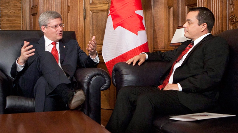 Prime Minister Stephen Harper gestures as he sits down to speak with Assembly of First Nations Chief Shawn Atleo in his office on Parliament Hill in Ottawa, Thursday, Dec. 1, 2011. (Adrian Wyld / THE CANADIAN PRESS)