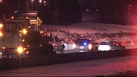 Police investigate a single-vehicle crash involving an off-duty RCMP officer. Jan. 16, 2012. (CTV)