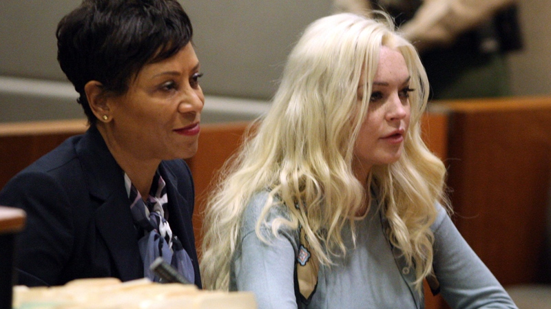 Lindsay Lohan appears with her attorney Shawn Chapman Holley in Los Angeles Superior Court for a probation progress hearing Tuesday, Jan. 17, 2012. (AP / Gary Friedman)