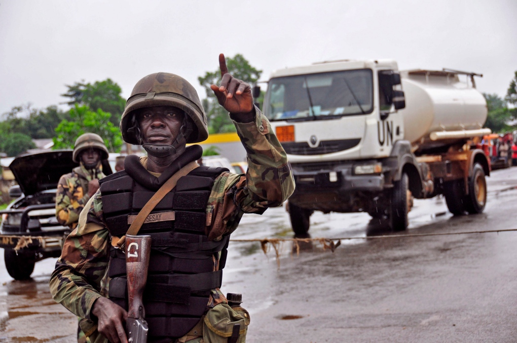 Liberian soldier at Ebola security checkpoint