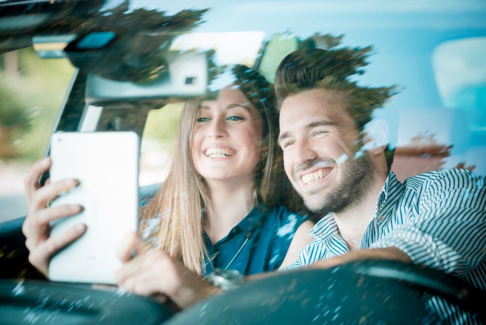 Driver and passenger taking a selfie