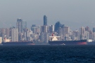 The Vancouver skyline and large freighters are seen through the heat rising off the water of English Bay, B.C. on Monday, May 14, 2012. (Johnathan Hayward/THE CANADIAN PRESS)