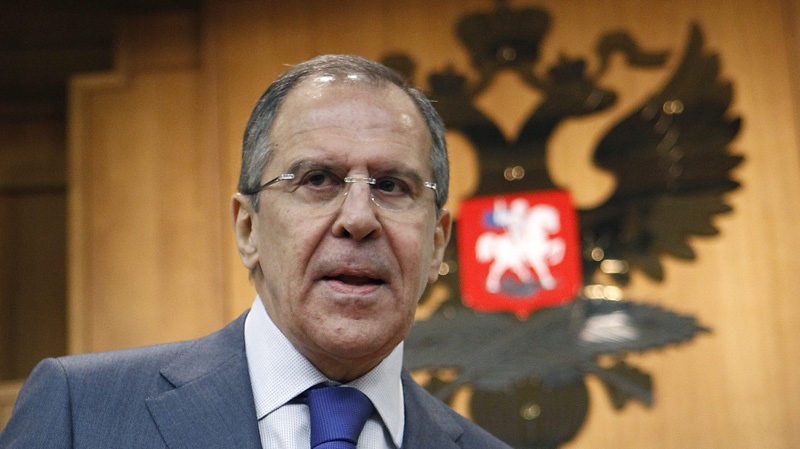 Russian Foreign Minister Sergey Lavrov walks to speak at a news conference in Moscow, Russia, Wednesday, Jan. 18, 2012. (AP Photo/Mikhail Metzel)