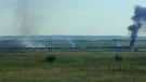 Smoke billows from the scene of a train derailment near Caron late Monday afternoon. (Cody Jordison/Twitter)